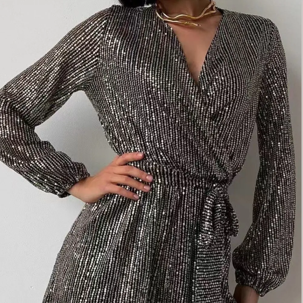 Full Size Sequin Surplice Tie Waist Long Sleeve Romper