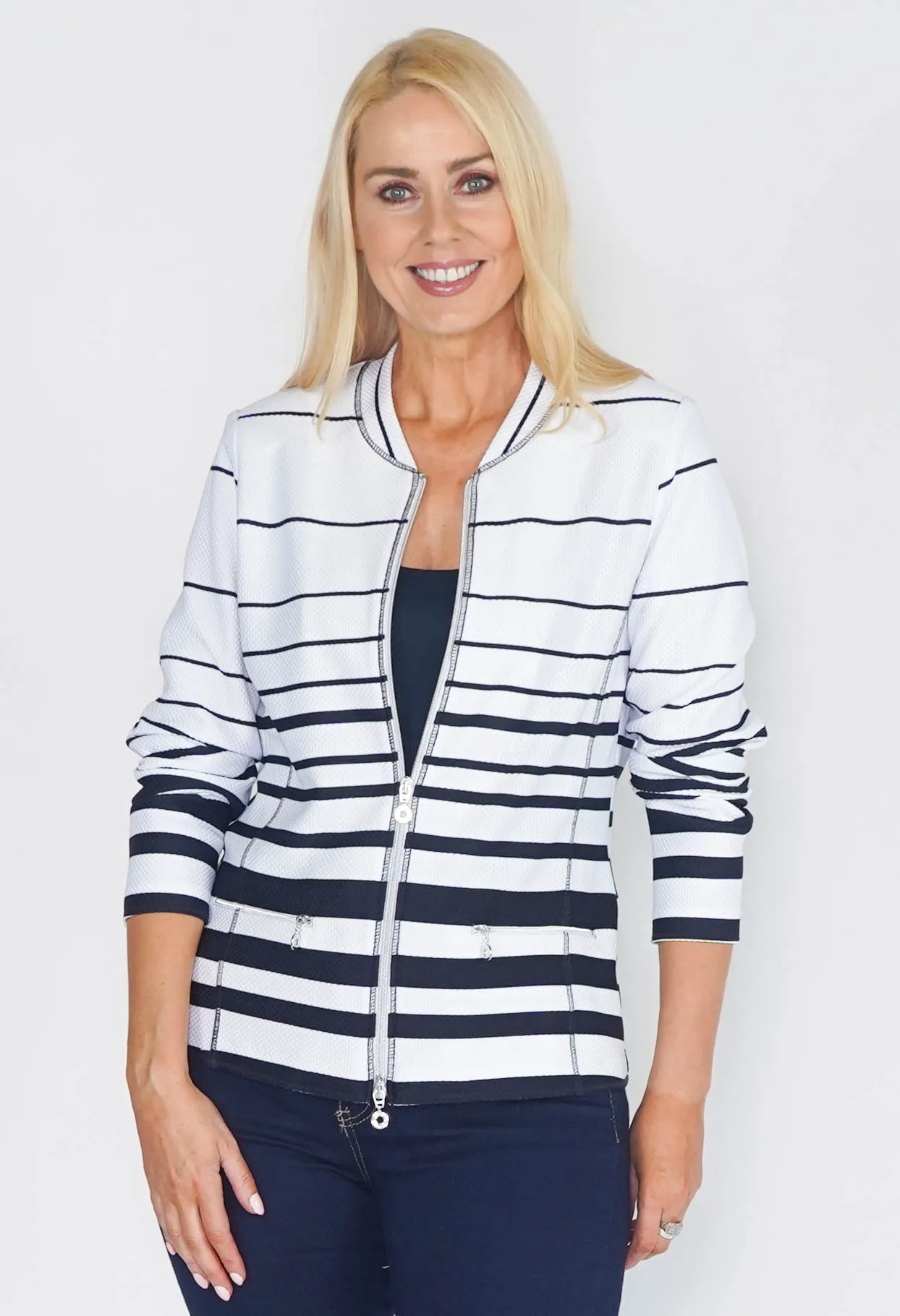 ZIP THROUGH CARDIGAN IN WHITE WITH NAVY STRIPES.